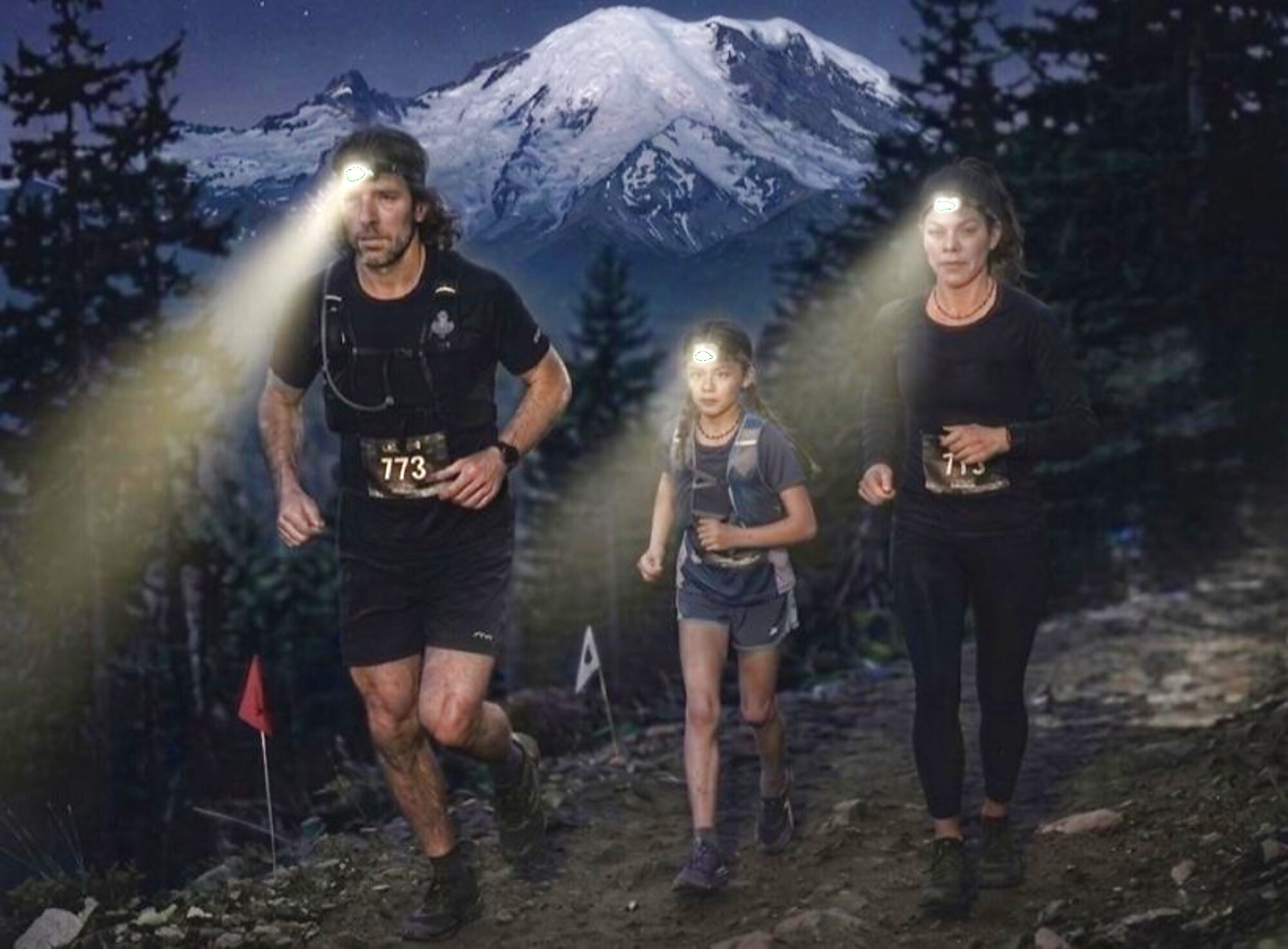 Runners crossing high ground by headlamp before dawn